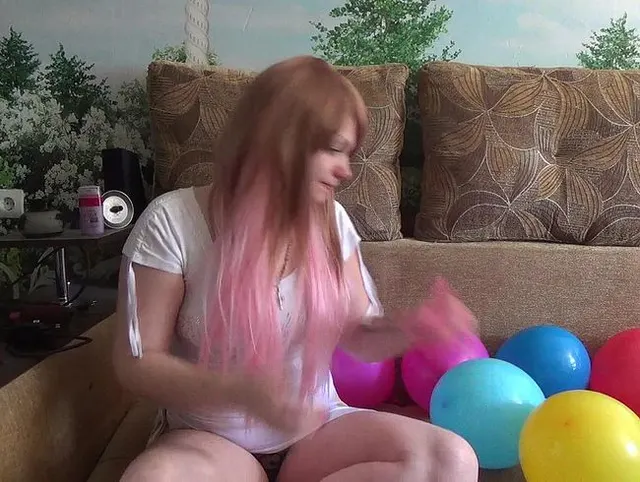 i am blowing 10 different color balloons