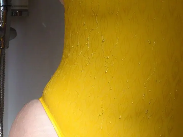 Yellow Mighty Suit in the Shower